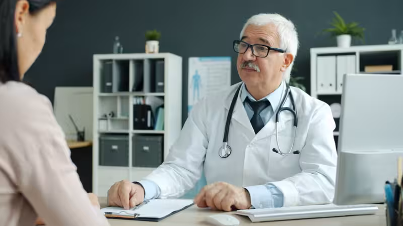 Private Care for Younger Patients and Family Reassurance: A doctor in a clinic Doctor in clinic for Private Care for Younger Patients and Family Reassurance - About Hearing First Muswell Hill Clinic